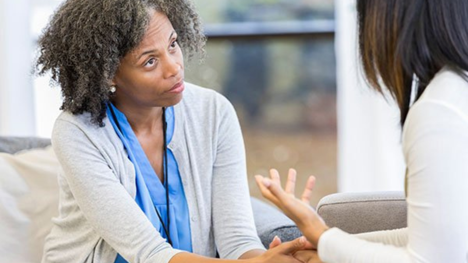 African American counselor meeting with Black patient in Charlotte therapy office